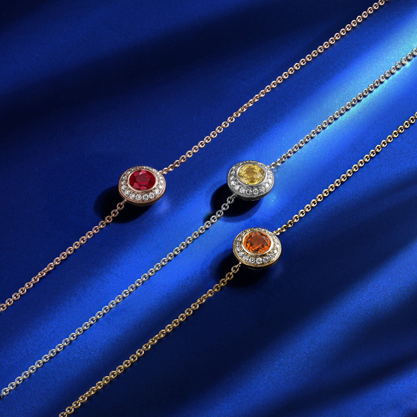 Royal Harmony Bracelet Centered Around Ruby set all around pave in diamonds designed by carati jewelry in montreal canada in 14 k 18 k in blue backround with yellow and orrnge sapphires