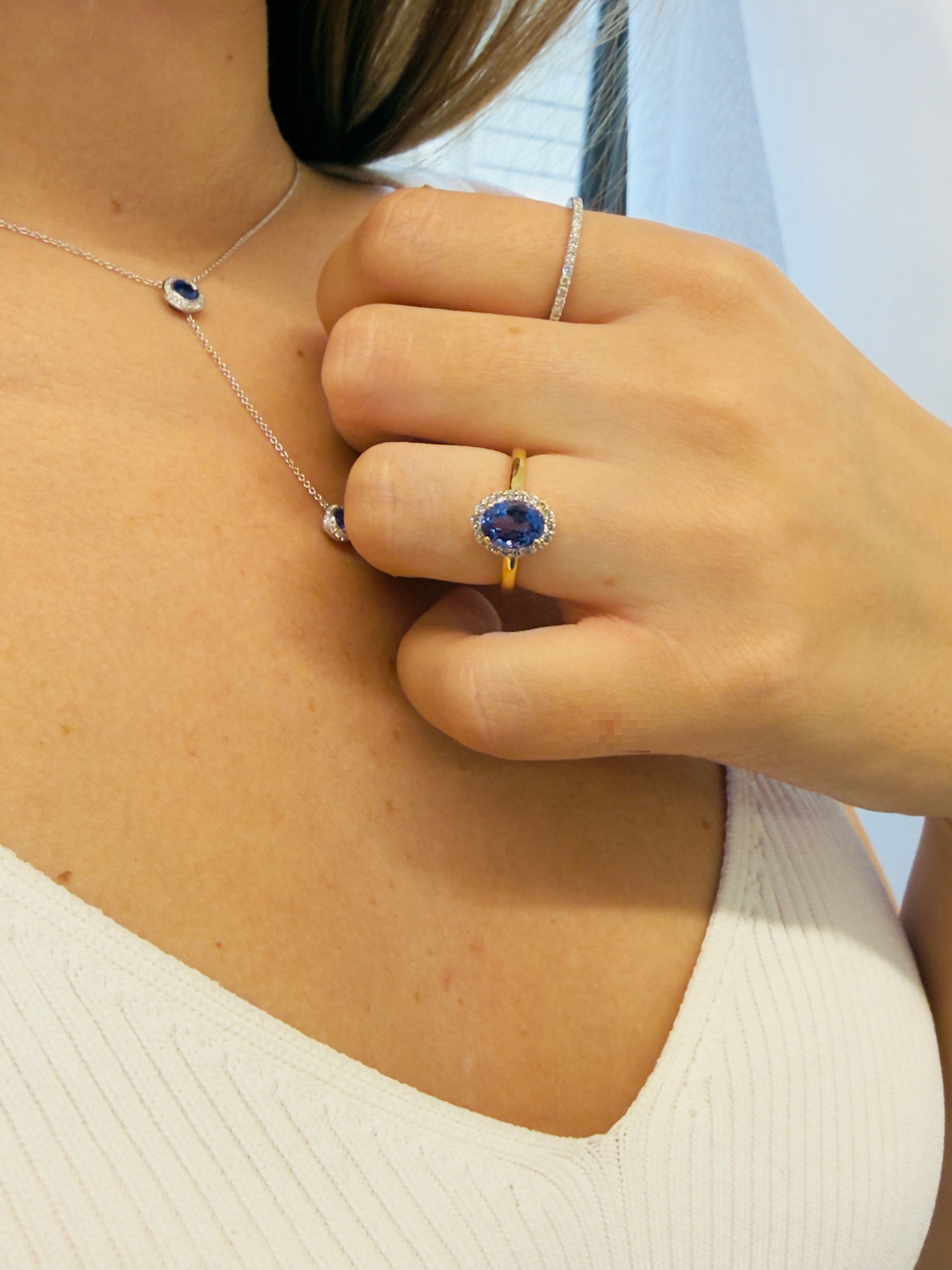 Oval Tanzanite With Diamond Halo All Around