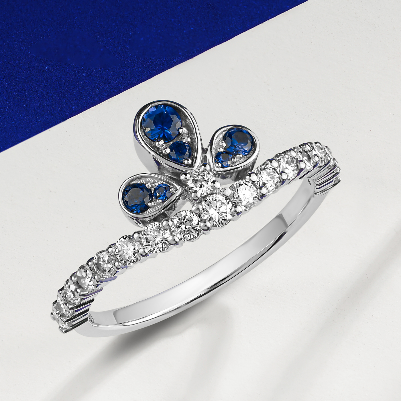 Bloom ring set with sapphires and diamonds going half way designined by carati jewelry montreal canada 18 k 14 k with white backround zoom