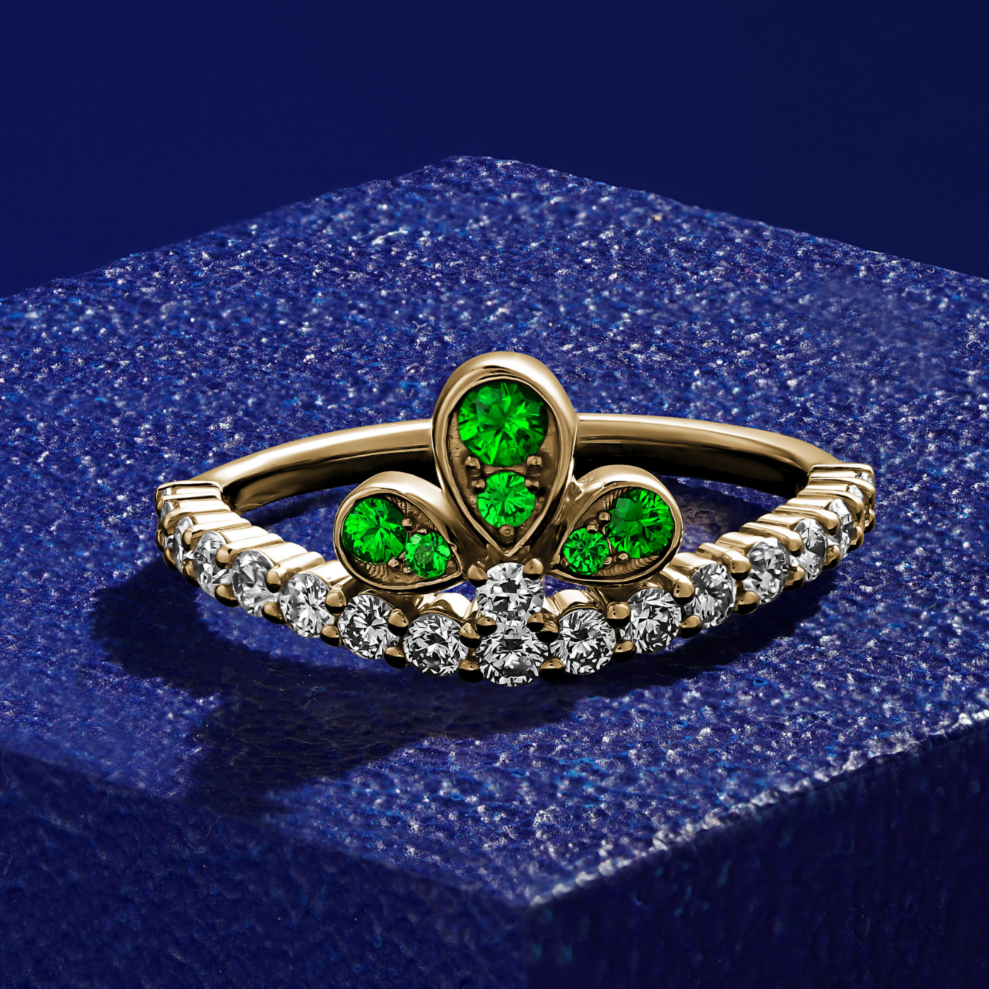 Bloom ring set with tzavorites and diamonds going half way designined by carati jewelry montreal canada 18 k 14 k in blue backround zoom