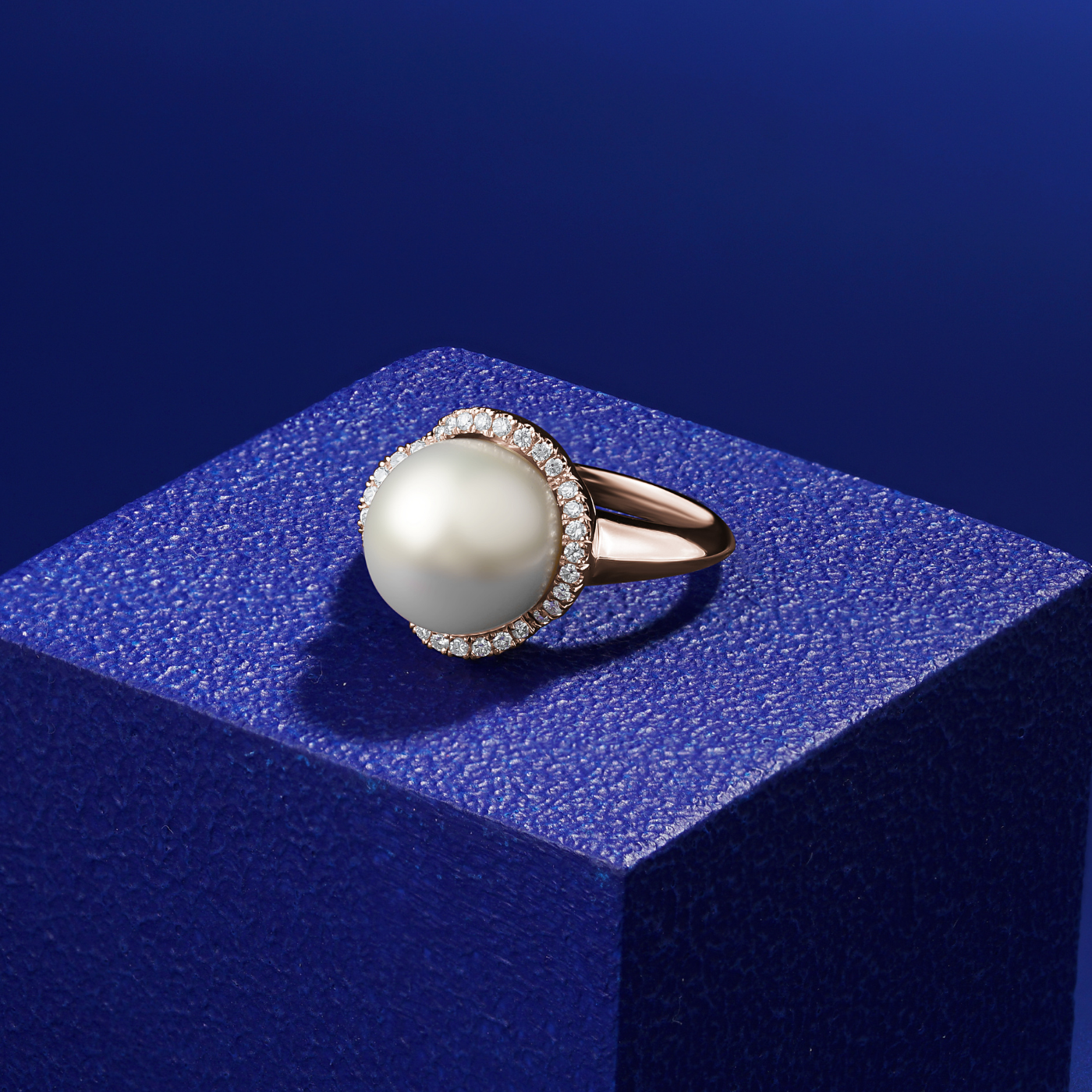Petal design ring with a south sea pearl ring set all in diamonds designed by carati jewelry montreal canada 18k 14 k  in blue backround