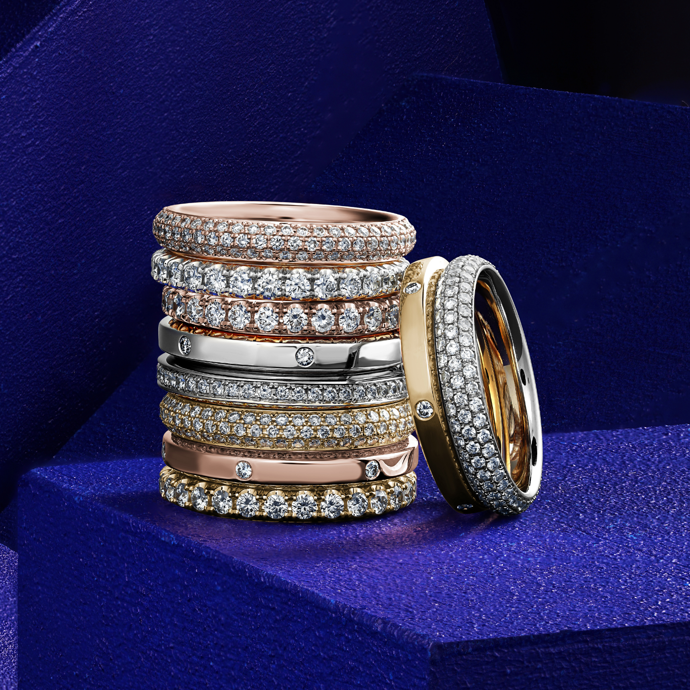 A gold wedding bands featuring a channel set of full rubies, with a total of 14 rubies visible in the image.wedding bands channel set rubies diamonds full pave sets gypsy set all in one image ontop of each other