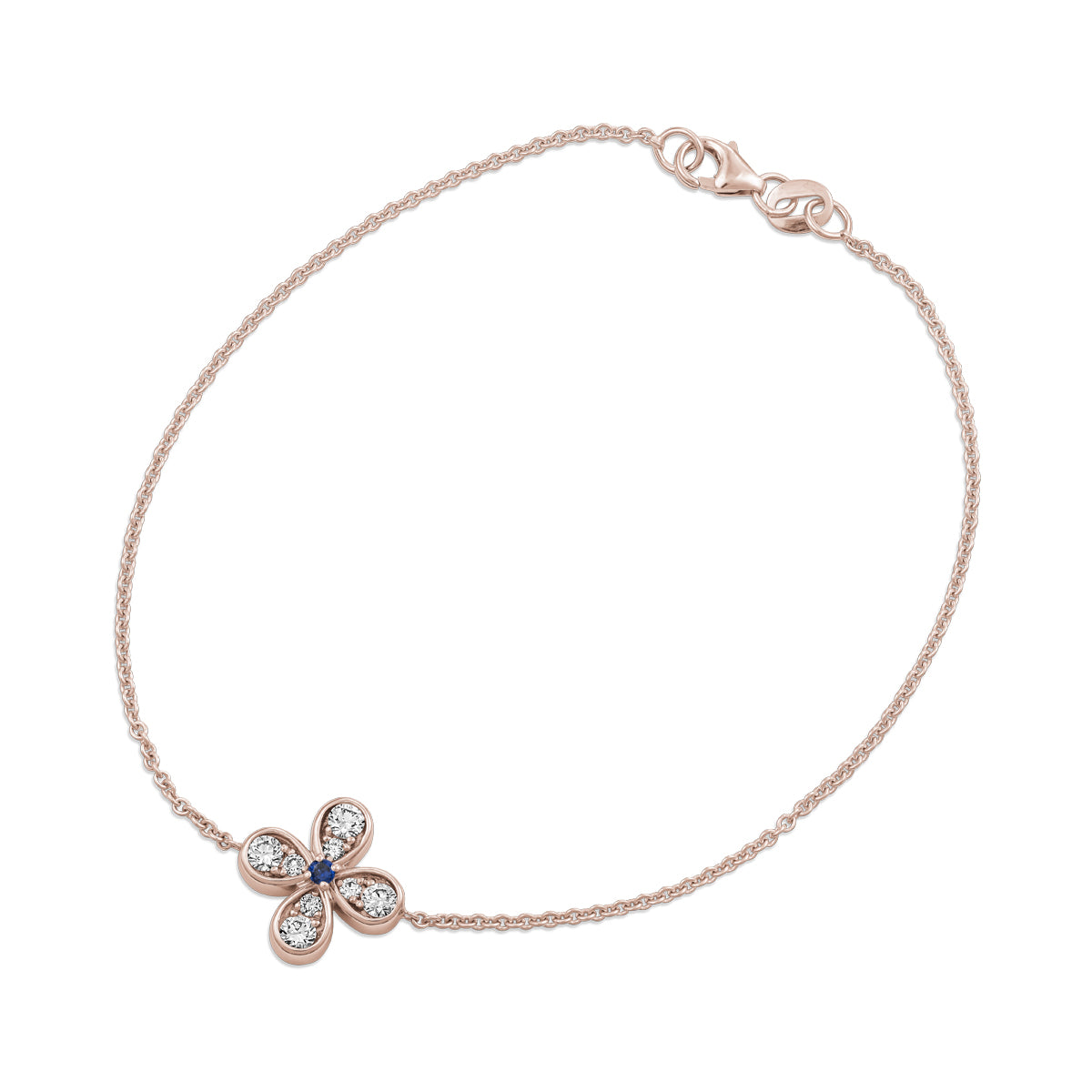 Bloom bracelet with a floral charm featuring a blue sapphire center and small diamond accents designed by carati jewelry in montreal canada in 18 k 14 k