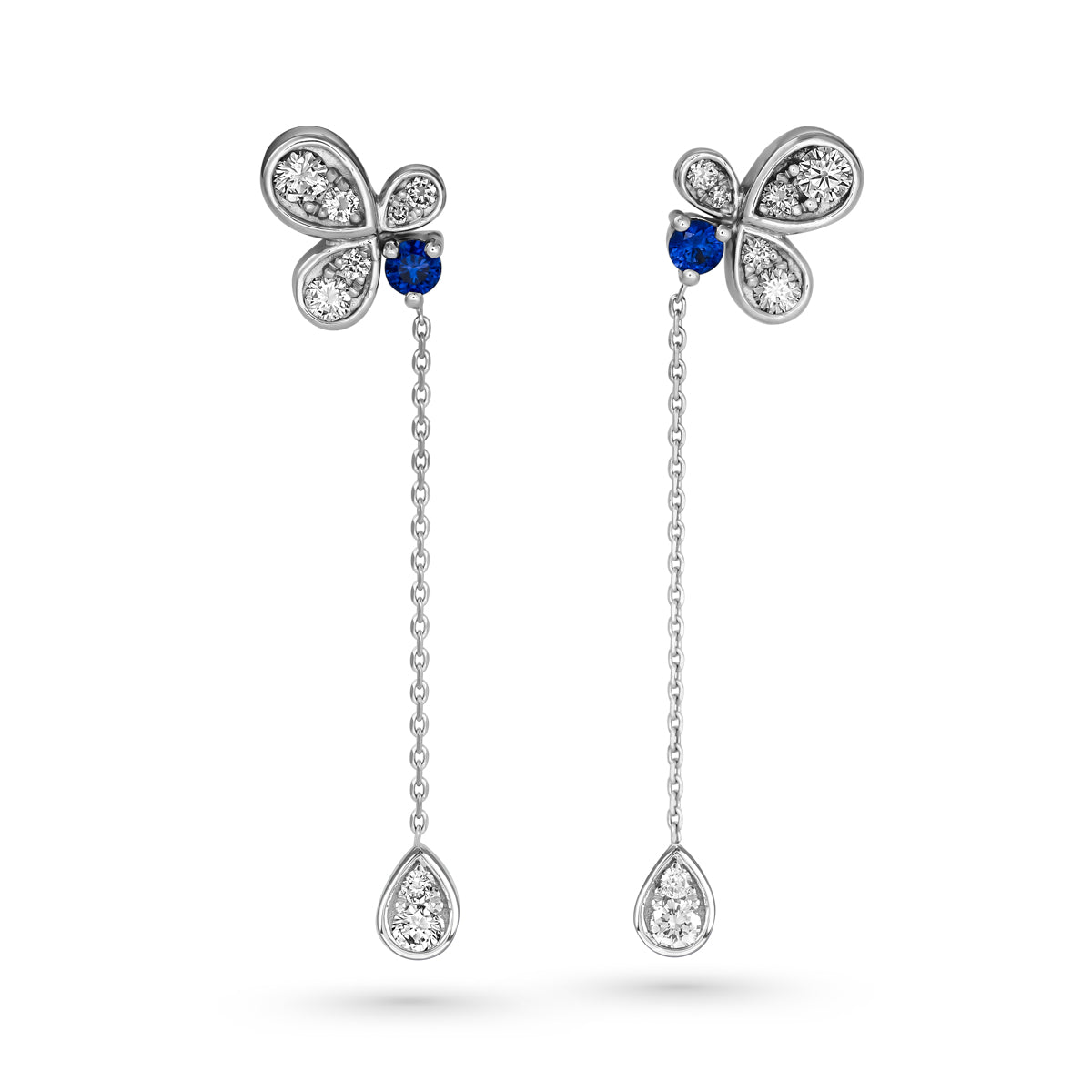 Bloom pair of earrings featuring royal blue sapphires with butterfly designs, connected to diamond-studded chains designed by carati jewelry in montreal canada in 18 k 14 k