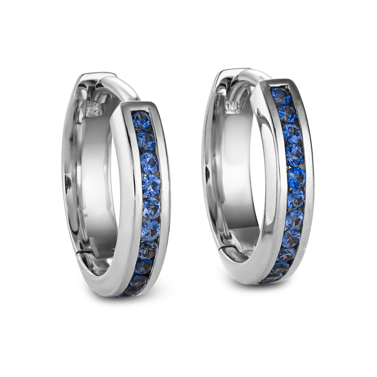 A pair of gold hoop earrings with blue sapphire channel set detailing designed by carati jewelry montreal canada in 18 k 14 k earrings