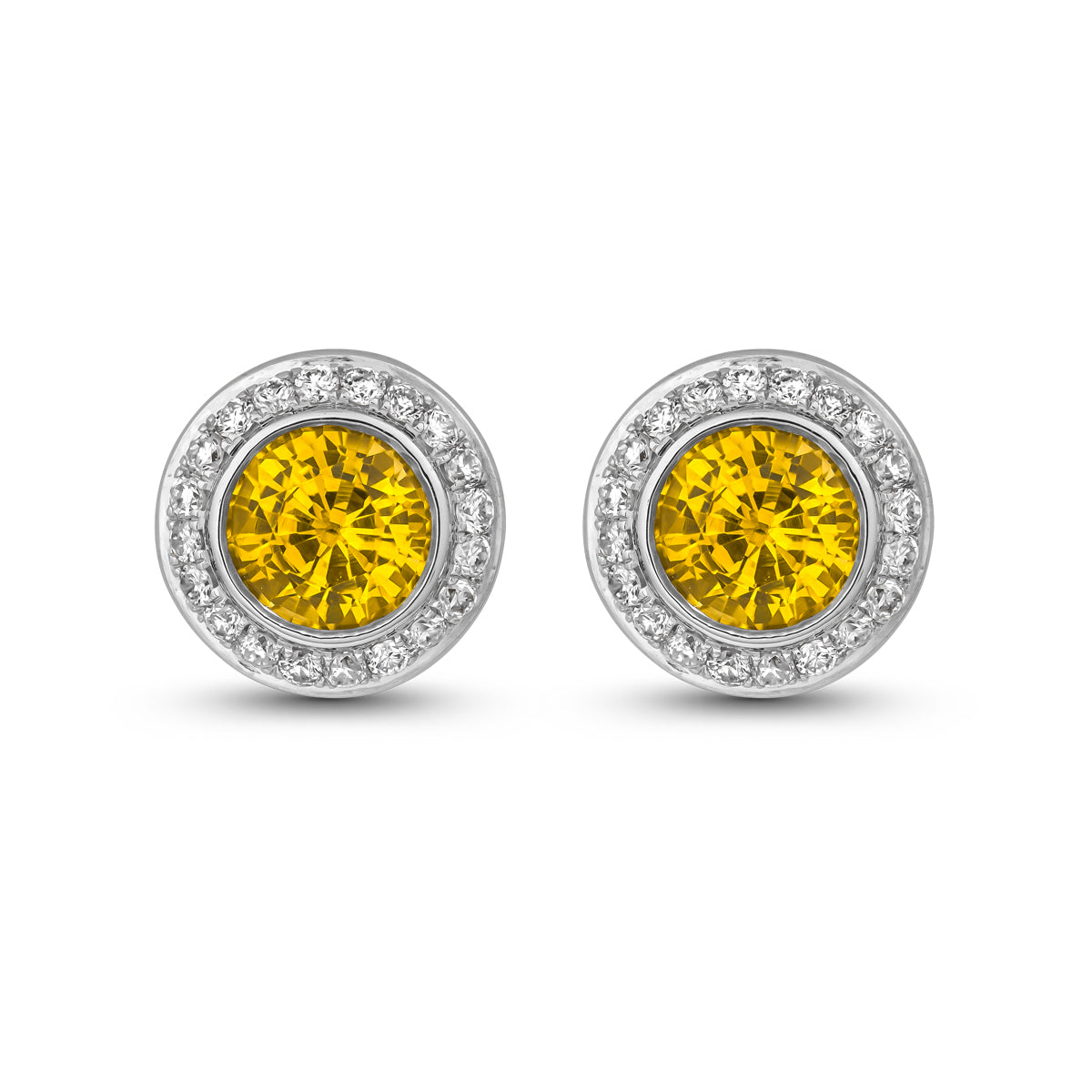 Royal Harmony earring Centered Around a stunning yellow sapphire set all around pave in diamonds designed by carati jewelry in montreal canada in 14 k 18 k