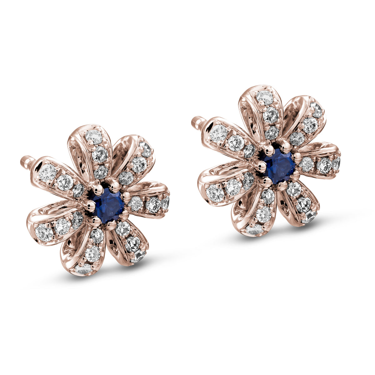 A pair of Fiora earrings with natural royal blue sapphires centers and encrusted with diamonds set in pave designed by carati jewelry montreal canada 18k 14 k