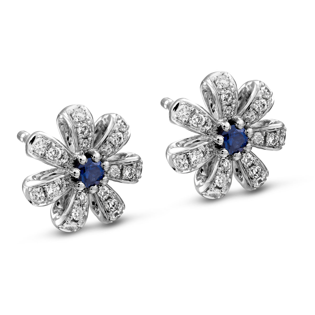 A pair of Fiora earrings with natural royal blue sapphires centers and encrusted with diamonds set in pave designed by carati jewelry montreal canada 18k 14 k