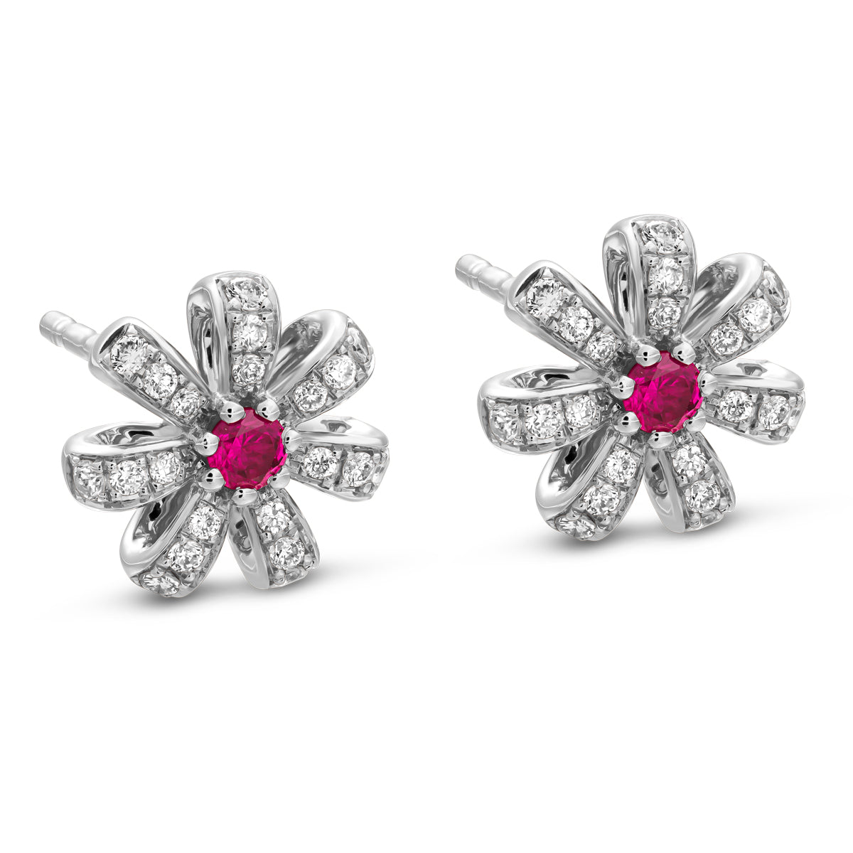 A pair of rose gold Fiora earrings with natural ruby centers and encrusted with diamonds set in pave designed by carati jewelry montreal canada 18k 14 k