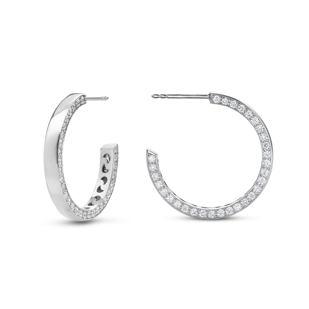 14 k white gold big eclipse earring set with dimonds on one side designed carati jewelry montreal