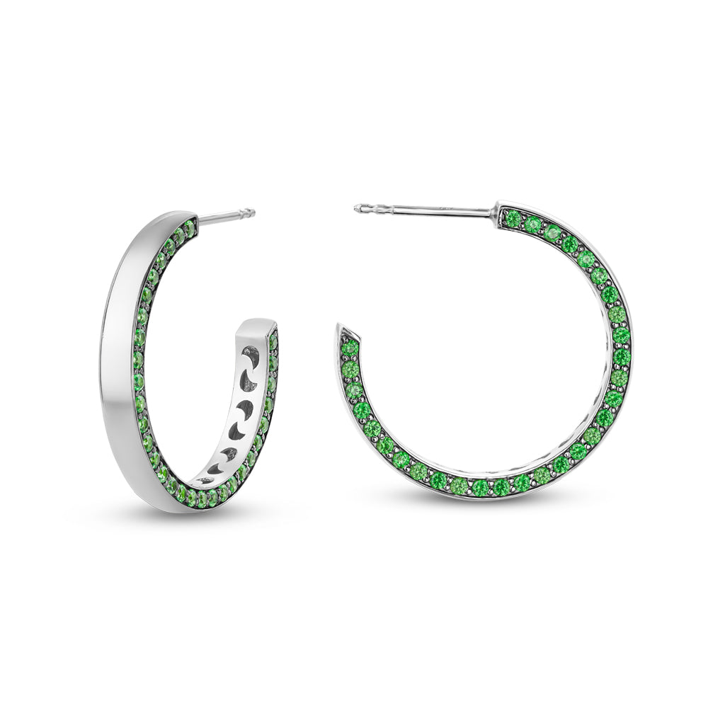 14 k white gold big eclipse earring set with grenn tsavorites on one side designed carati jewelry montreal