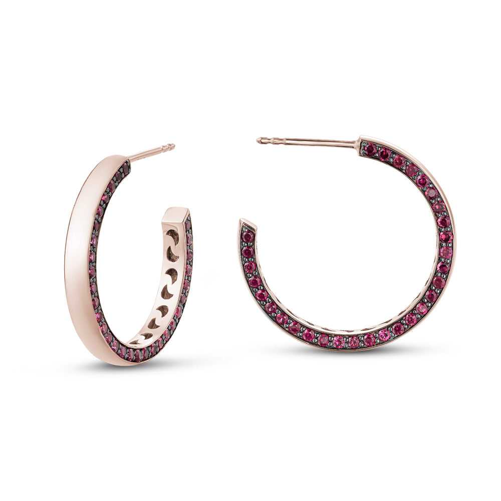 14 k rose gold big eclipse earring set with rubiess on one side designed carati jewelry montreal