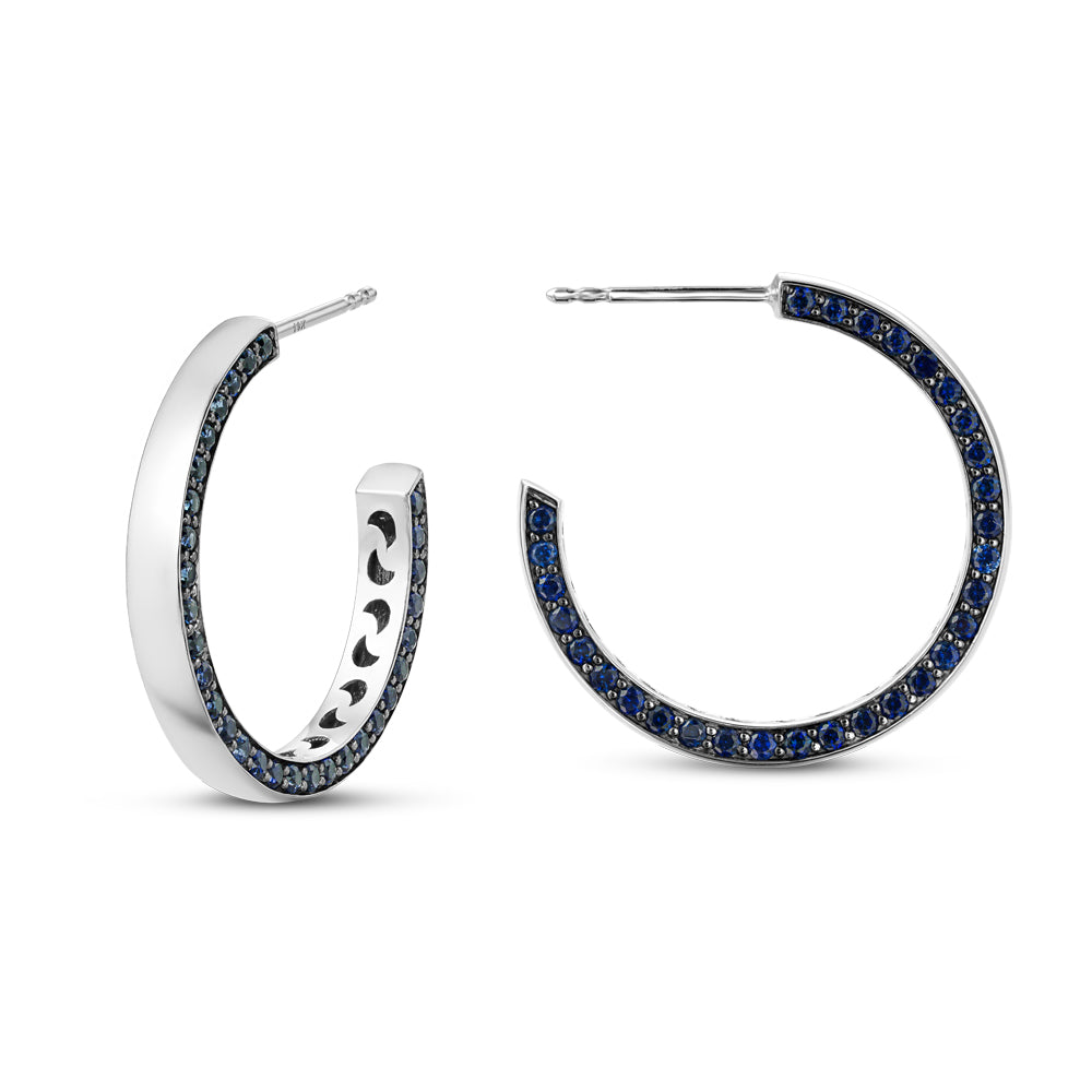 14 k white gold eclipse earring set with blue sapphires on one side designed carati jewelry montreal