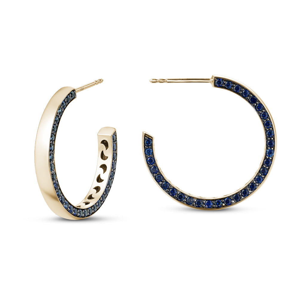 14 k yellow gold eclipse earring set with blue sapphires on one side designed carati jewelry montreal