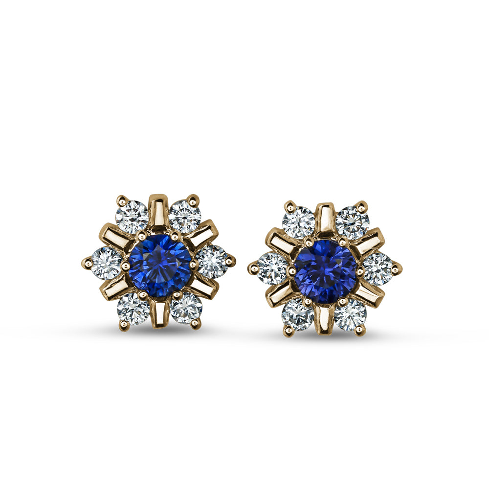 18 K yellow GOLD snowflake design set center a blue sapphire and surrounded in diamonds carati jewelry montreal
