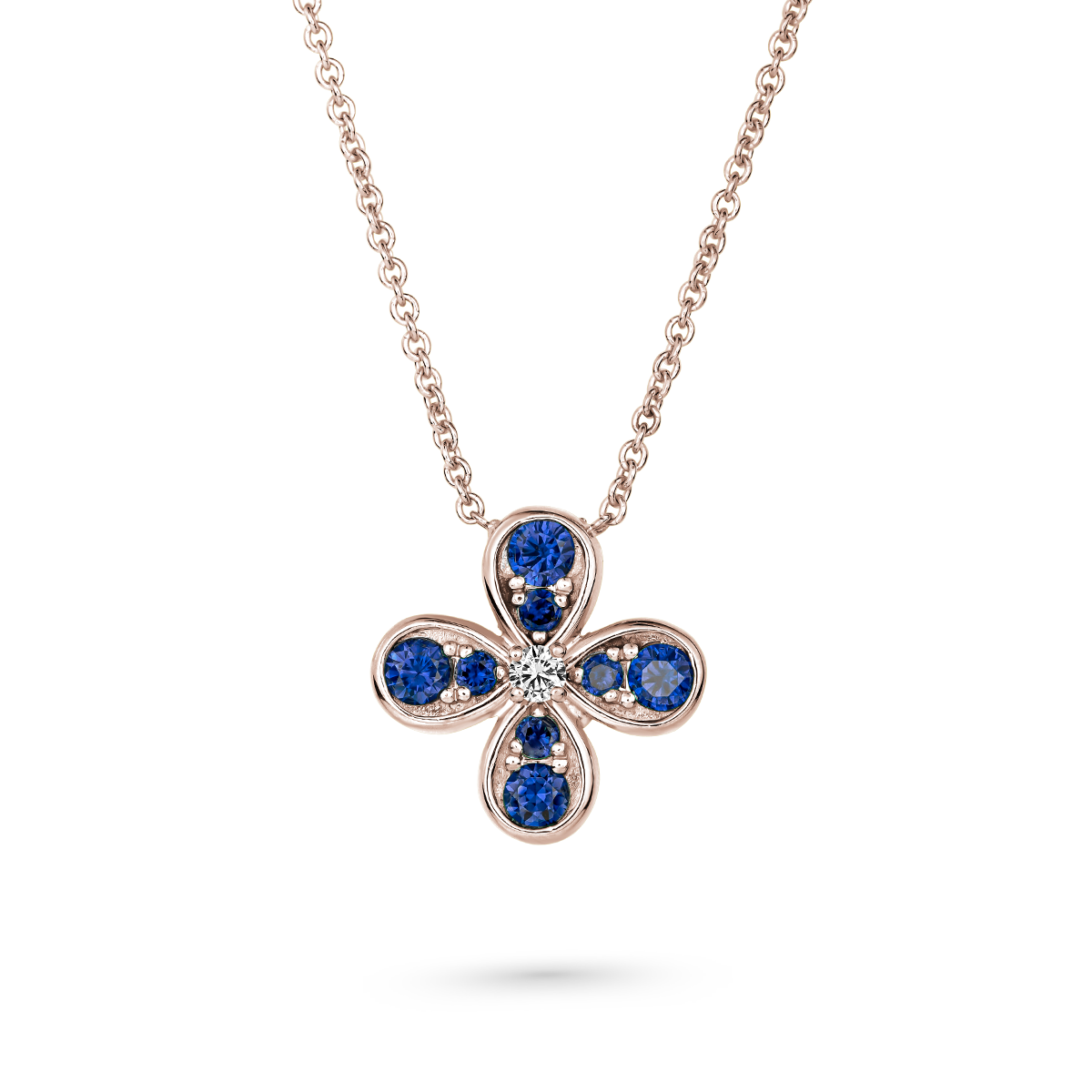 Bloom pendant set in royal blue sapphires and a diamond in the middle designed by carati jewelry montreal canada 18k 14 k