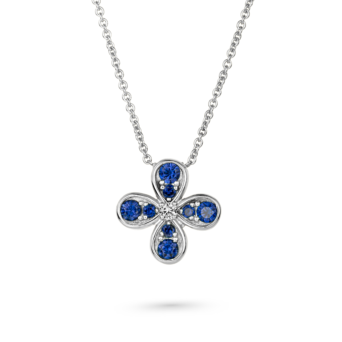 Bloom pendant set in royal blue sapphires and a diamond in the middle designed by carati jewelry montreal canada 18k 14 k