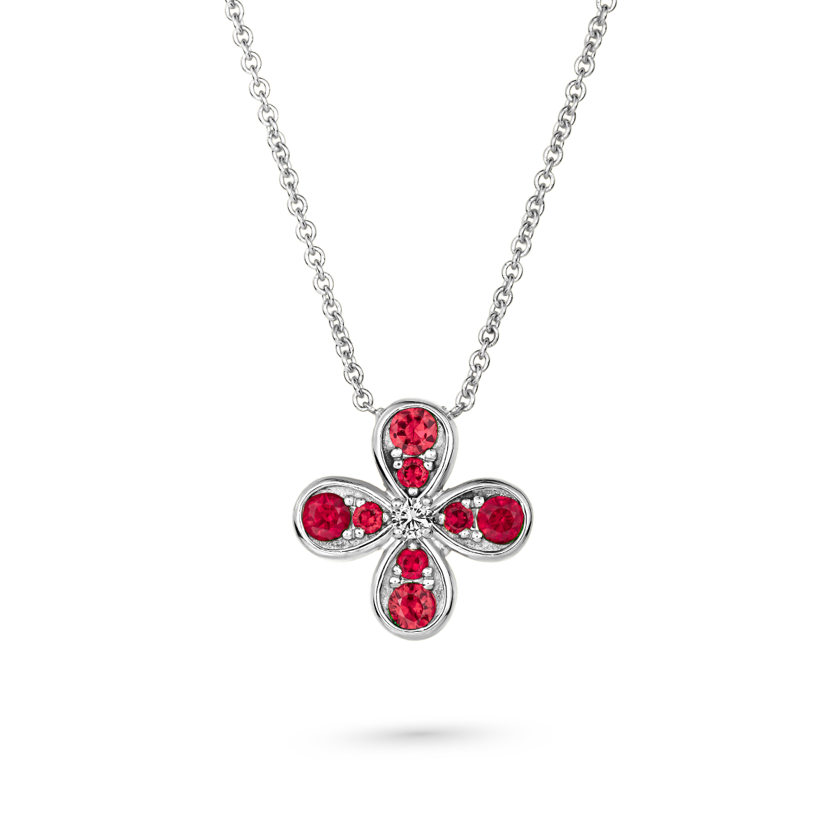 Bloom pendant set in ruby's and a diamond in the middle designed by carati jewelry montreal canada 18k 14 k