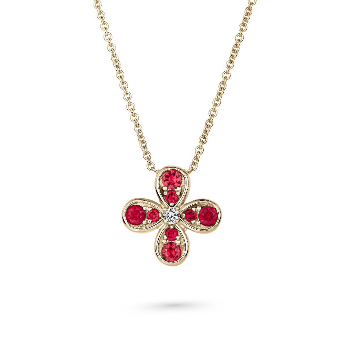 Bloom pendant set in ruby's and a diamond in the middle designed by carati jewelry montreal canada 18k 14 k