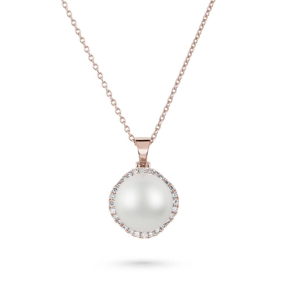 A natural pearl pendant with petal design nested within a circle of sparkling diamonds, mounted on a rose gold chain sophisticated spark designed by carati jewelry in montreal canada in 18 k 14 k