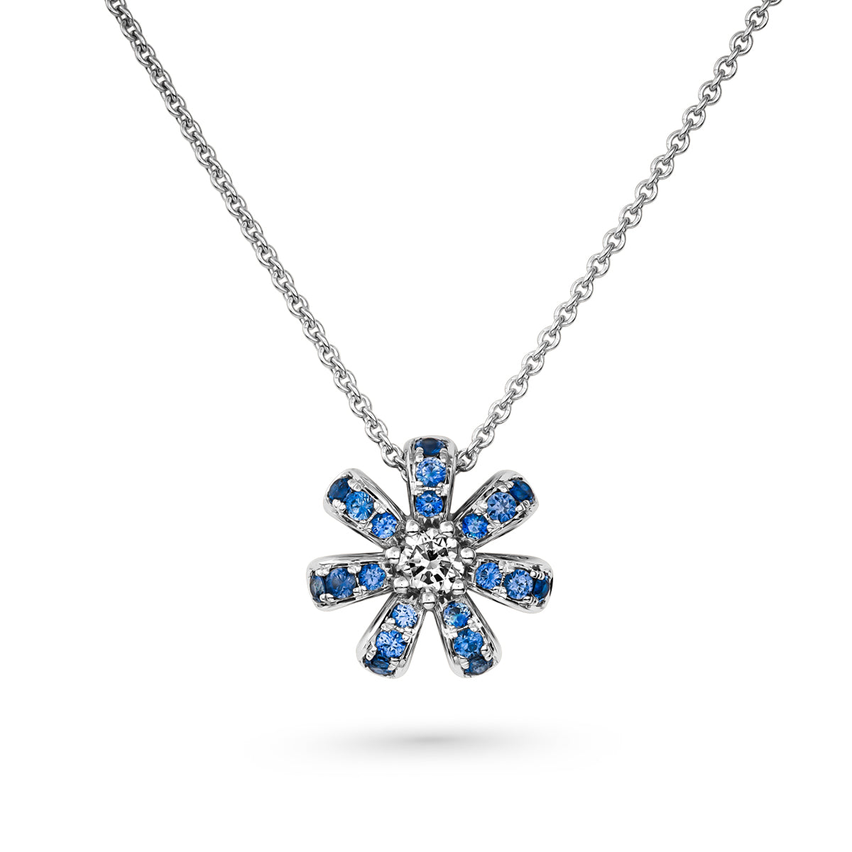 Fiora mini pendant set in pave blue sapphires and a Sparkling diamond in the middle is iconic design from carati jewelry in montreal canada in 1k 14 k