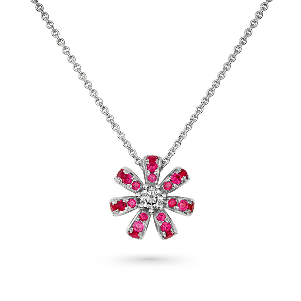Fiora mini pendant set in pave rubys and a Sparkling diamond in the middle is iconic design from carati jewelry in montreal canada in 18k 14 k