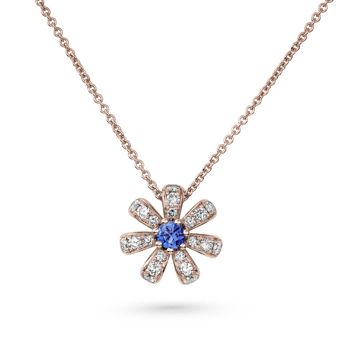Fiora pendant set in pave Diamonds and a Sparkling blue Sapphire in the middle is iconic design from carati jewelry in montreal canada in 1k 14 k