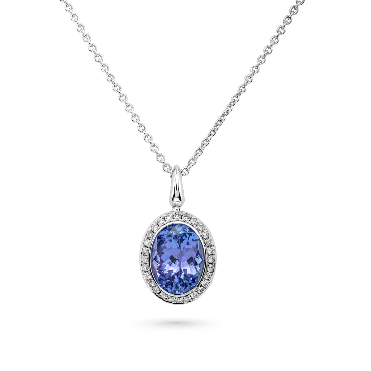 Royal Harmony Pendant with Tanzanite set with pave diamonds all around is designed by carati jewelry in Montreal Canada in 18k 14k