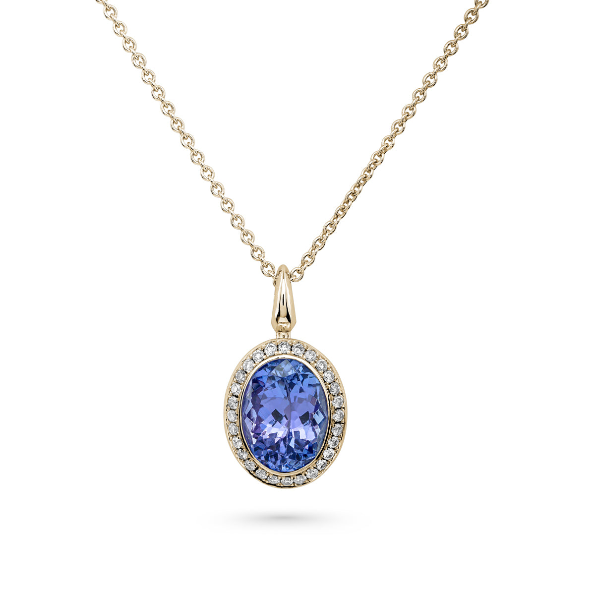 Royal Harmony Pendant with Tanzanite set with pave diamonds all around is designed by carati jewelry in Montreal Canada in 18k 14k