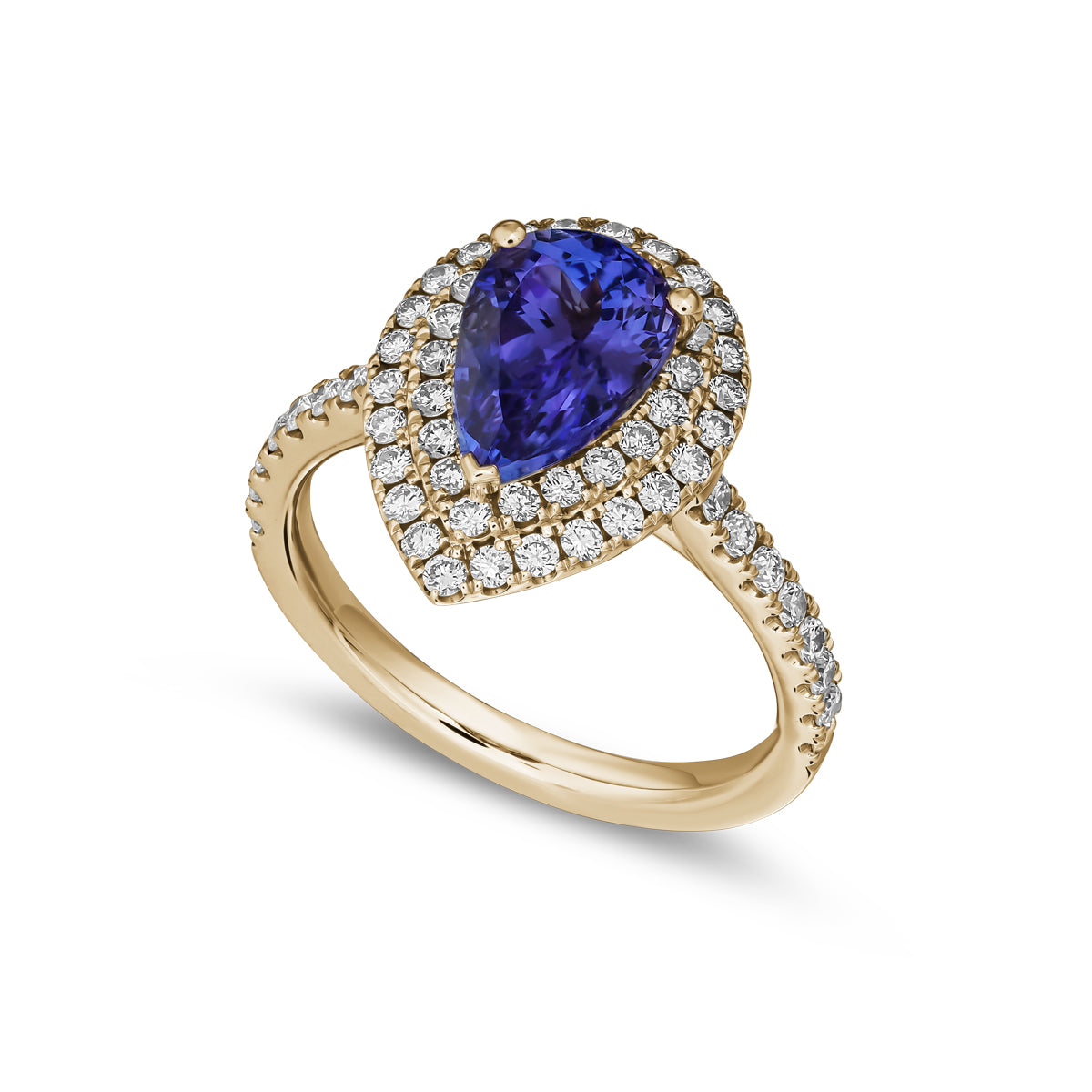 A two row two tone halo ring centered with a pear-shaped tanzanite stone and surrounded by smaller diamonds set in a silver or white gold band from carati jewelry montreal canada