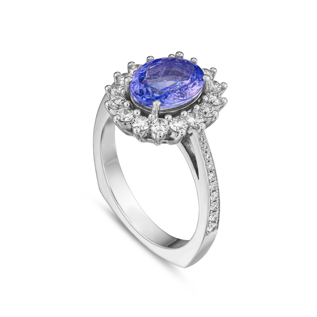 An elegant engagement ring with a central oval Tanzanite stone, surrounded by a halo of sparkling diamonds, set in a white gold band designed by carati jewelry in montreal canada 14 k 18 k