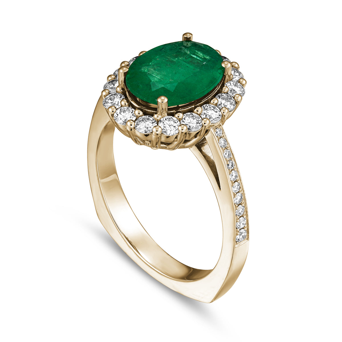 An oval emerald engagement ring with a halo of round diamonds around it and on the band, set in a white gold metal designed by carati jewelry montreal canada in 18k 14 k