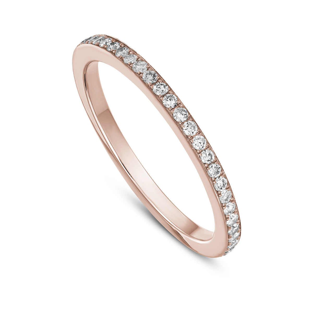A gold band ring with a full pave setting of sparkling diamonds designed by carati jewelry in montreal canada in 14 k 18 k