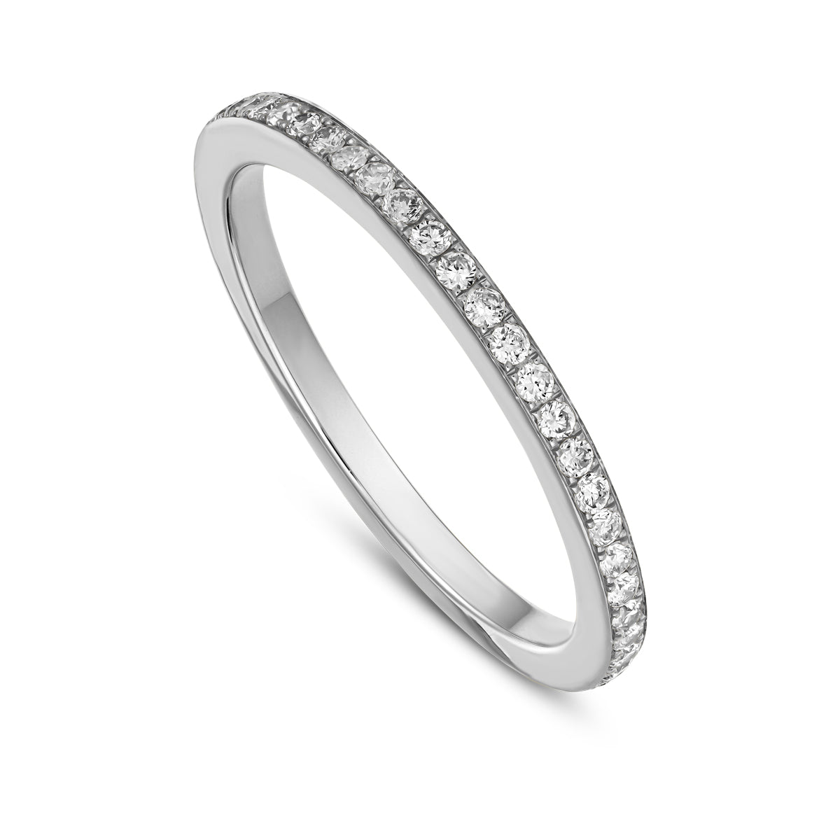 A gold band ring with a full pave setting of sparkling diamonds designed by carati jewelry in montreal canada in 14 k 18 k