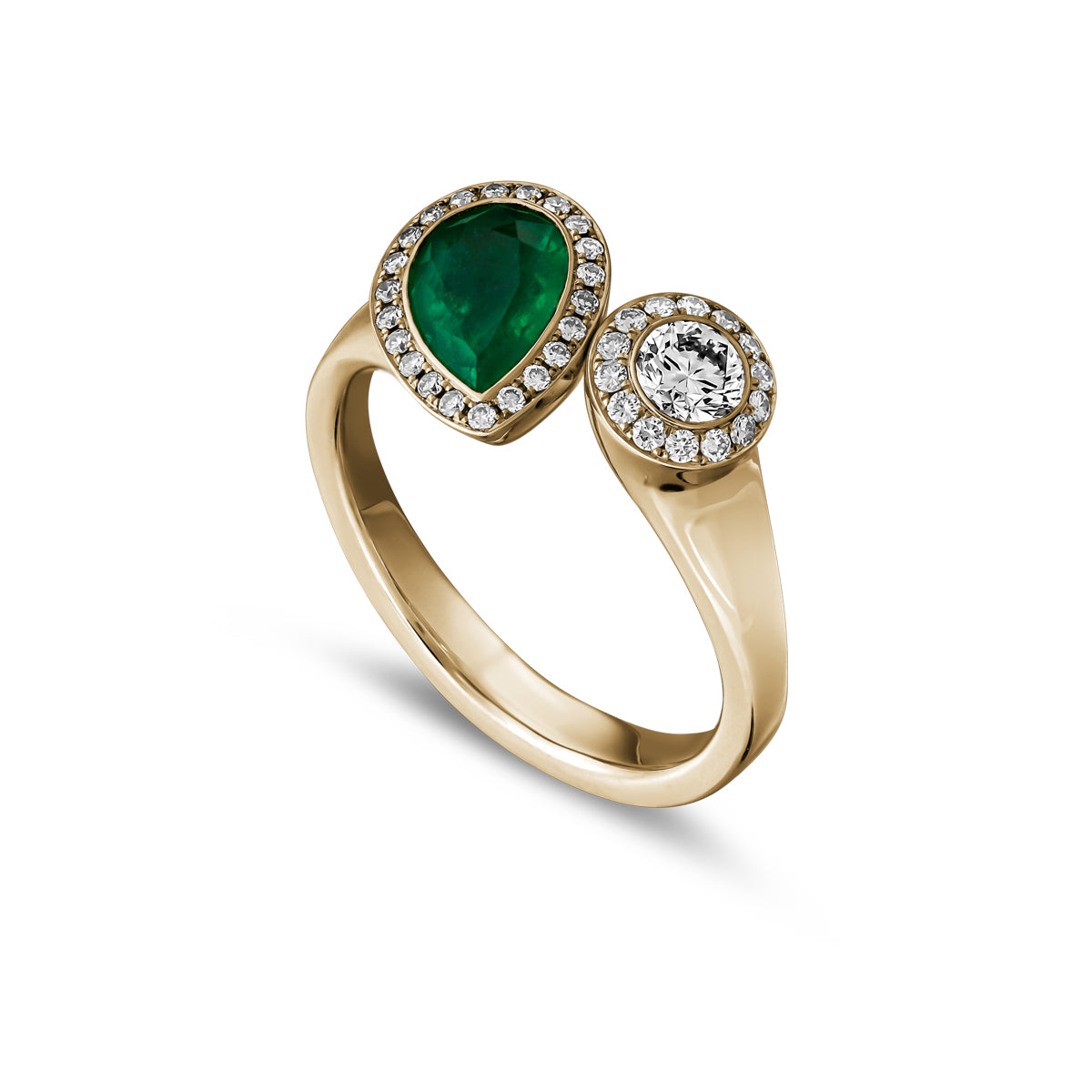 Toi et moi ring featuring a pear-shaped emerald and a smaller round diamond surrounded by a halo of smaller diamond accents designed by carati jewelry in montreal canada in 18 k 14 k diamonds.