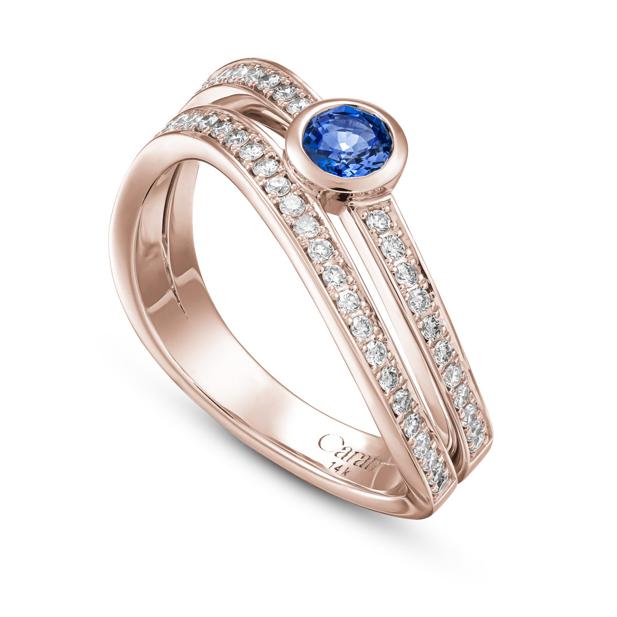 Double Wavy Ring with a royal blue sapphire in the middle and diamonds set in pave , iconic design by carati jewelry in montreal canada in 18k 14k