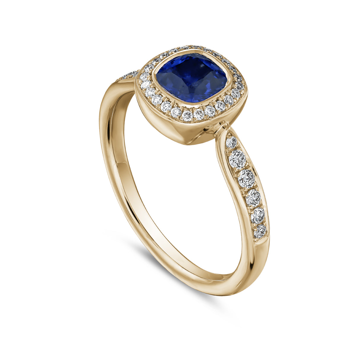 Royal harmony ring with royal blue sapphire cushion surrounded by pave diamonds and on the shank designed by carati jewelry in montreal canada 14k 18 k
