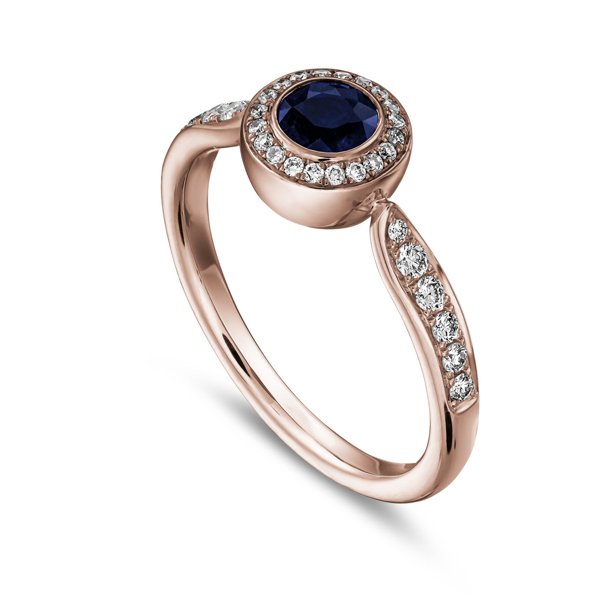 Royal harmony ring with round royal blue sapphireb surrounded by pave diamonds and on the shank designed by carati jewelry in montreal canada 18k 14 k