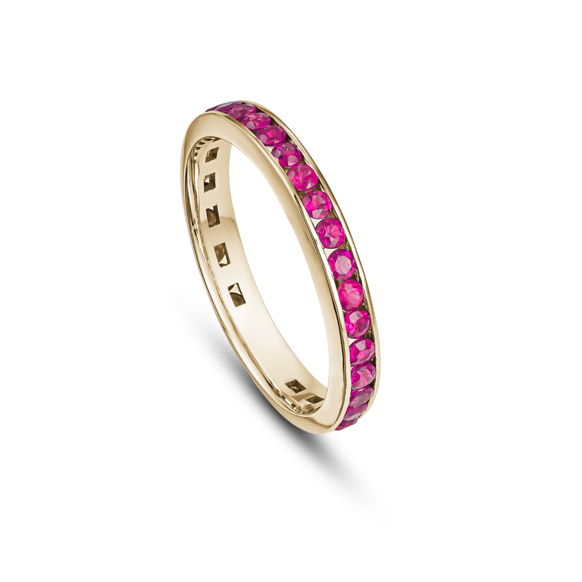 A gold wedding band featuring a channel set of full rubies, with a total of 14 rubies visible in the image.wedding bands channel set rubies diamonds