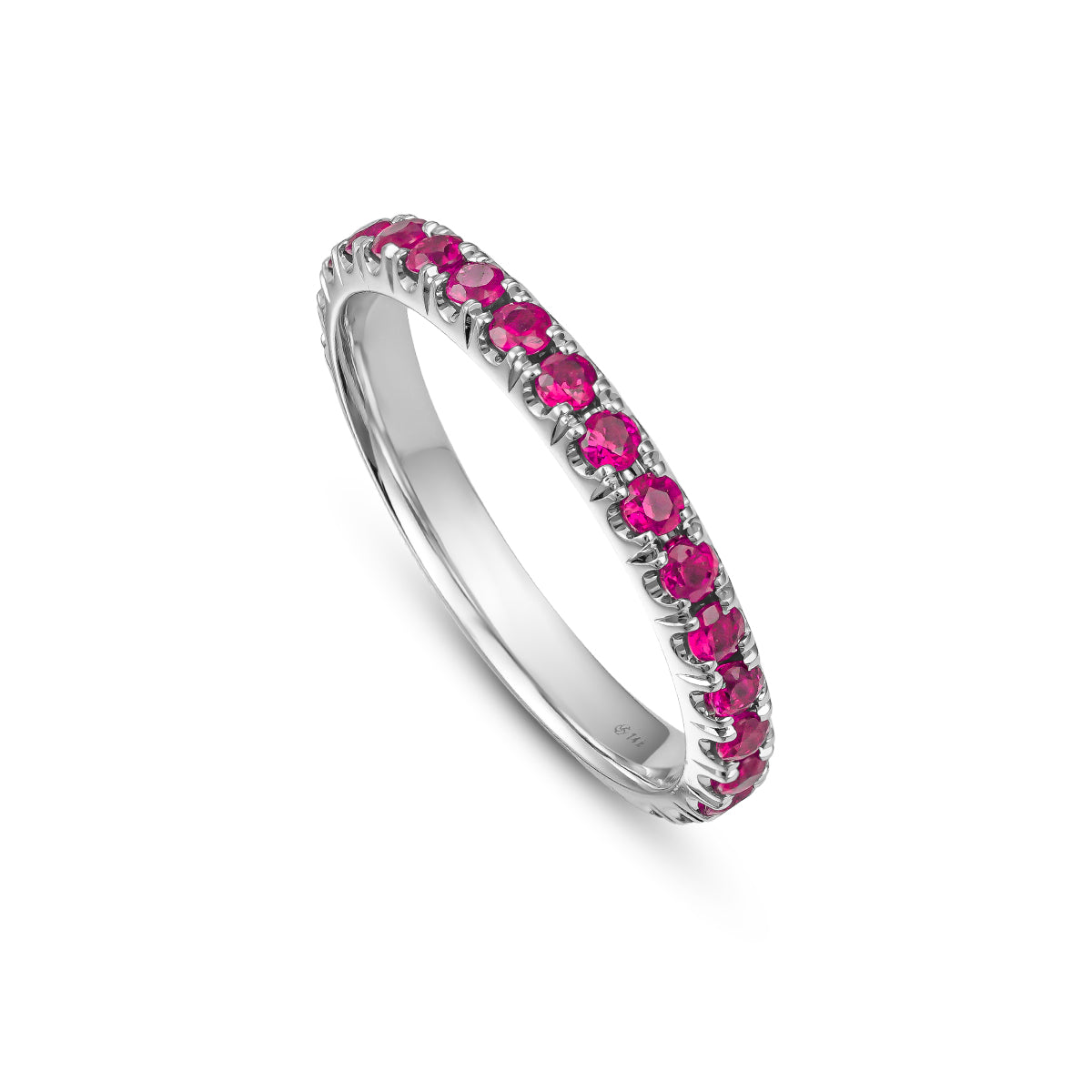 A gold engagement ring set with pigeon blood ruby stones, featuring intricate hand-engraved details.
