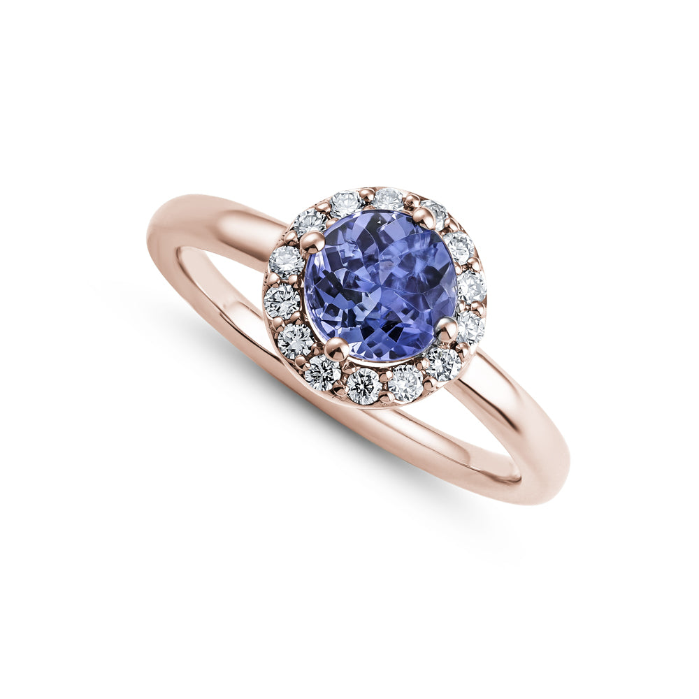 14k and 18 k white gold round tanzanite in center with diamond halo aroud it Carati Jewelry Montreal