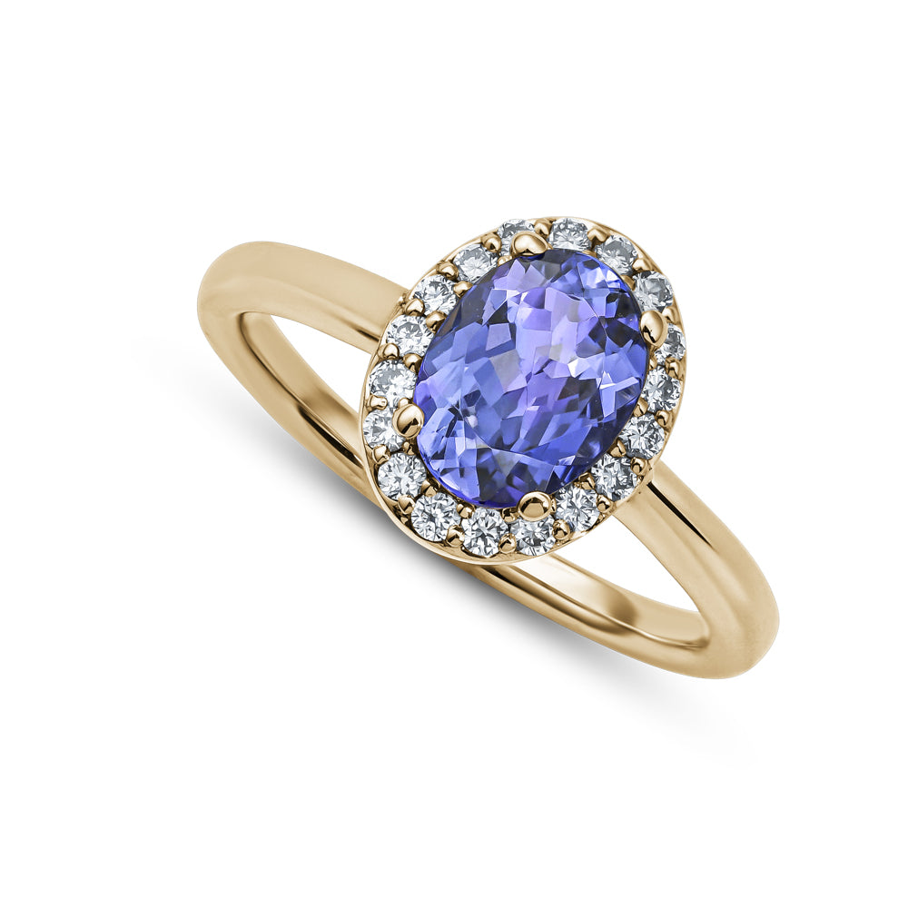 14k and 18k yellow gold oval tanzanite and halo set in diamonds carati jewelry montreal