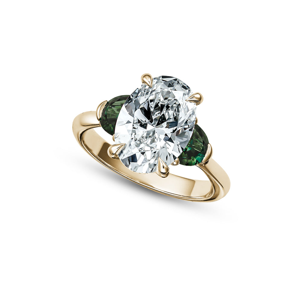 3 ct oval diamond with 2 moon sapphires in 18k yellow gold Carati jewelry montreal