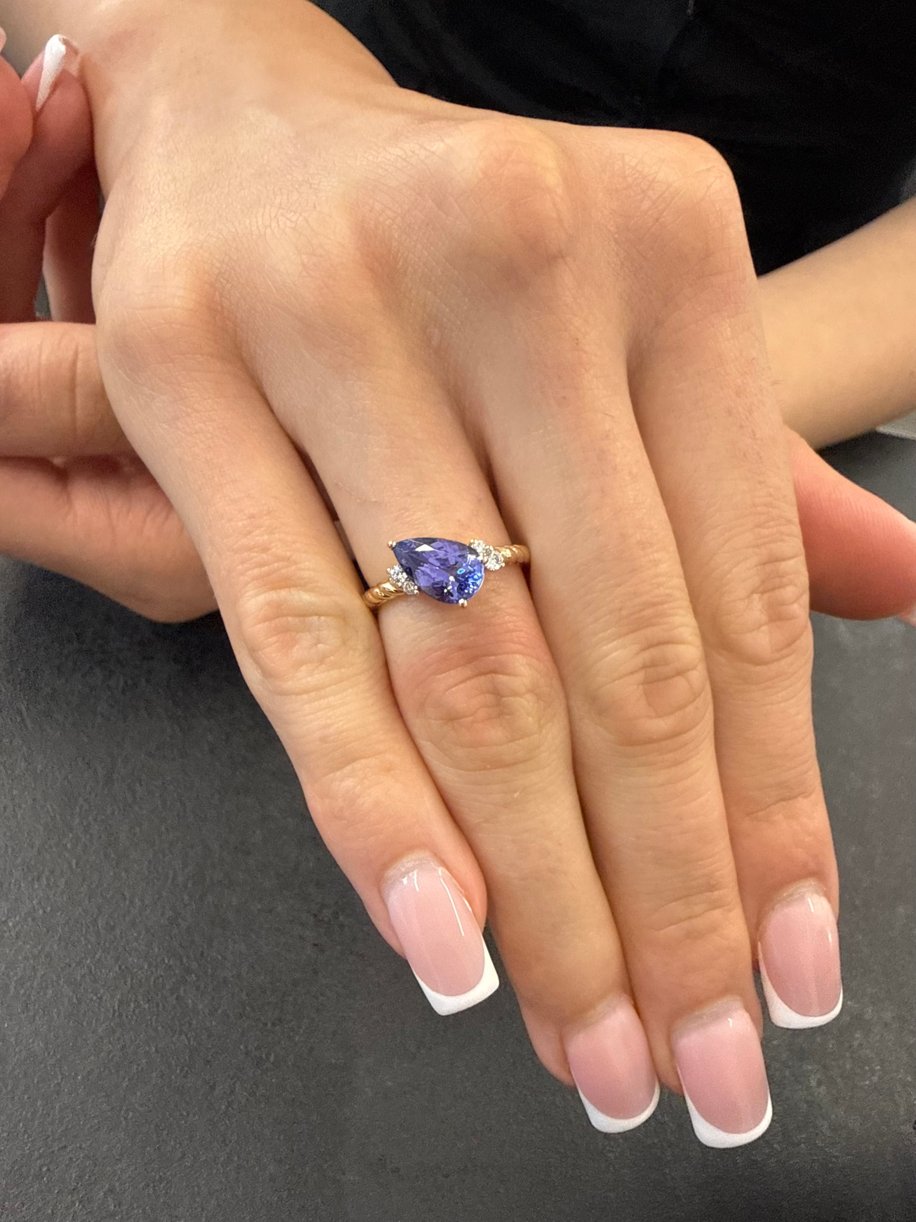 Pear Tanzanite Gem Set On Twisted Shank With Sparkling Diamonds