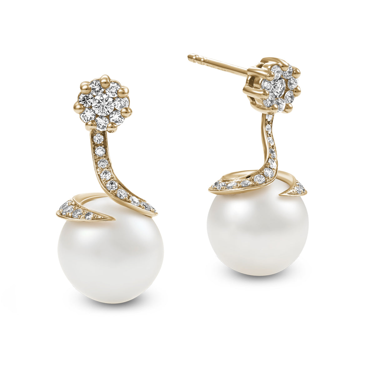 Spirale earrings with natural south sea pearlwith pave set diamonds in spirale design ,designed by carati jewelry montreal canada 18 k 14 k