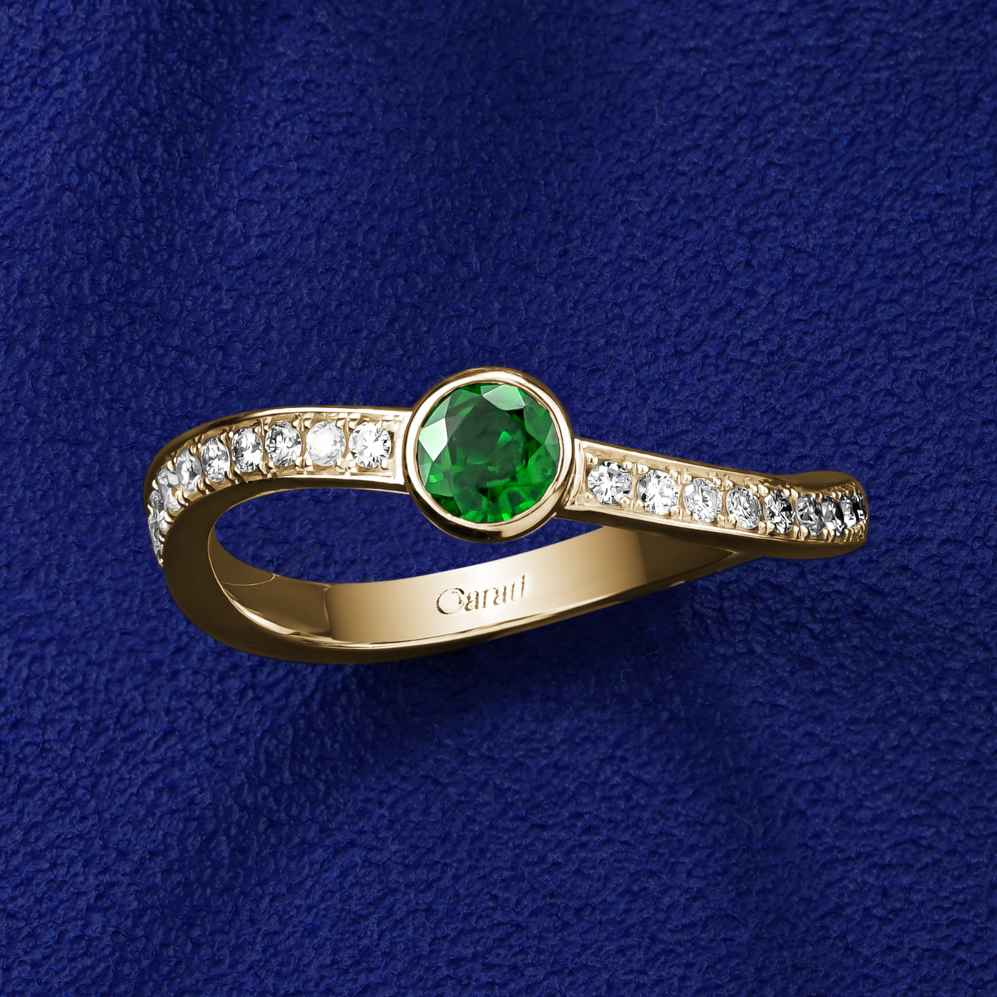 single Wavy Ring with a tsavorite in the middle and diamonds set in pave , iconic design by carati jewelry in montreal canada in 18k 14k with blue backround and zoomed