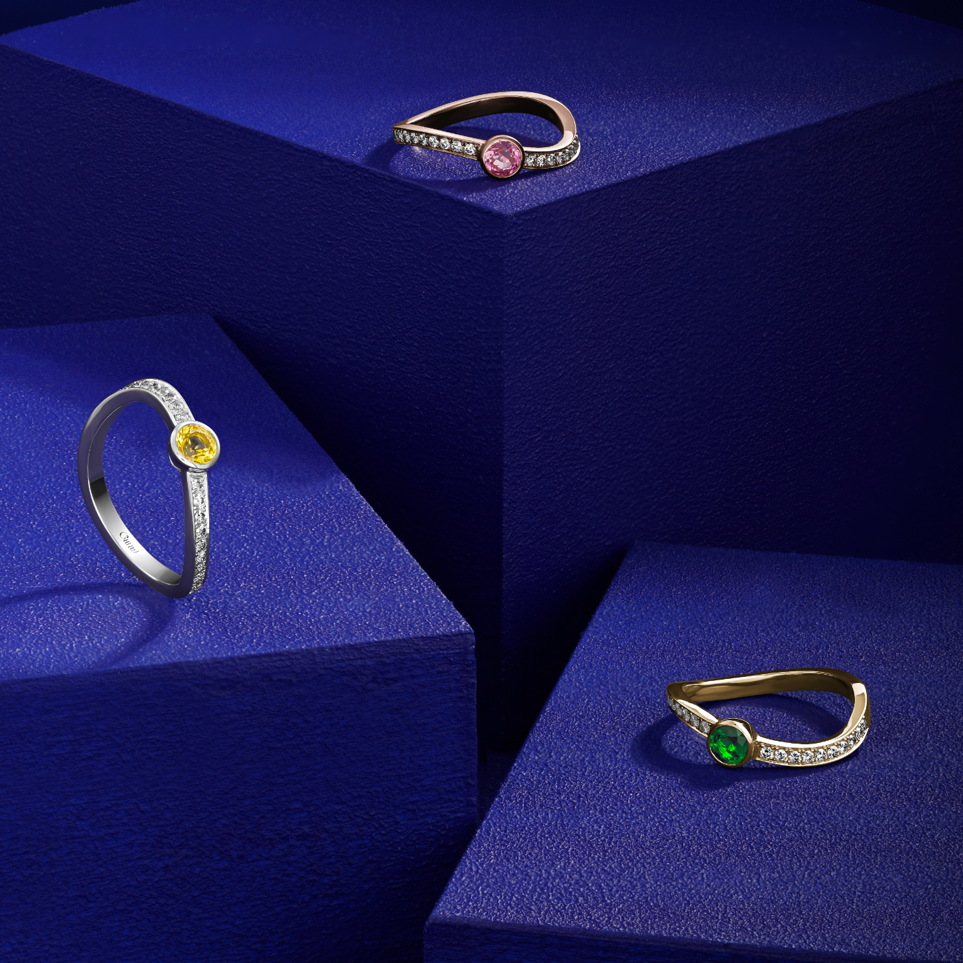 single Wavy Ring with a yellow sapphire in the middle and diamondsnset in pave , iconic design by carati jewelry in montreal canada in 18k 14k in blue backround with other 2 rings