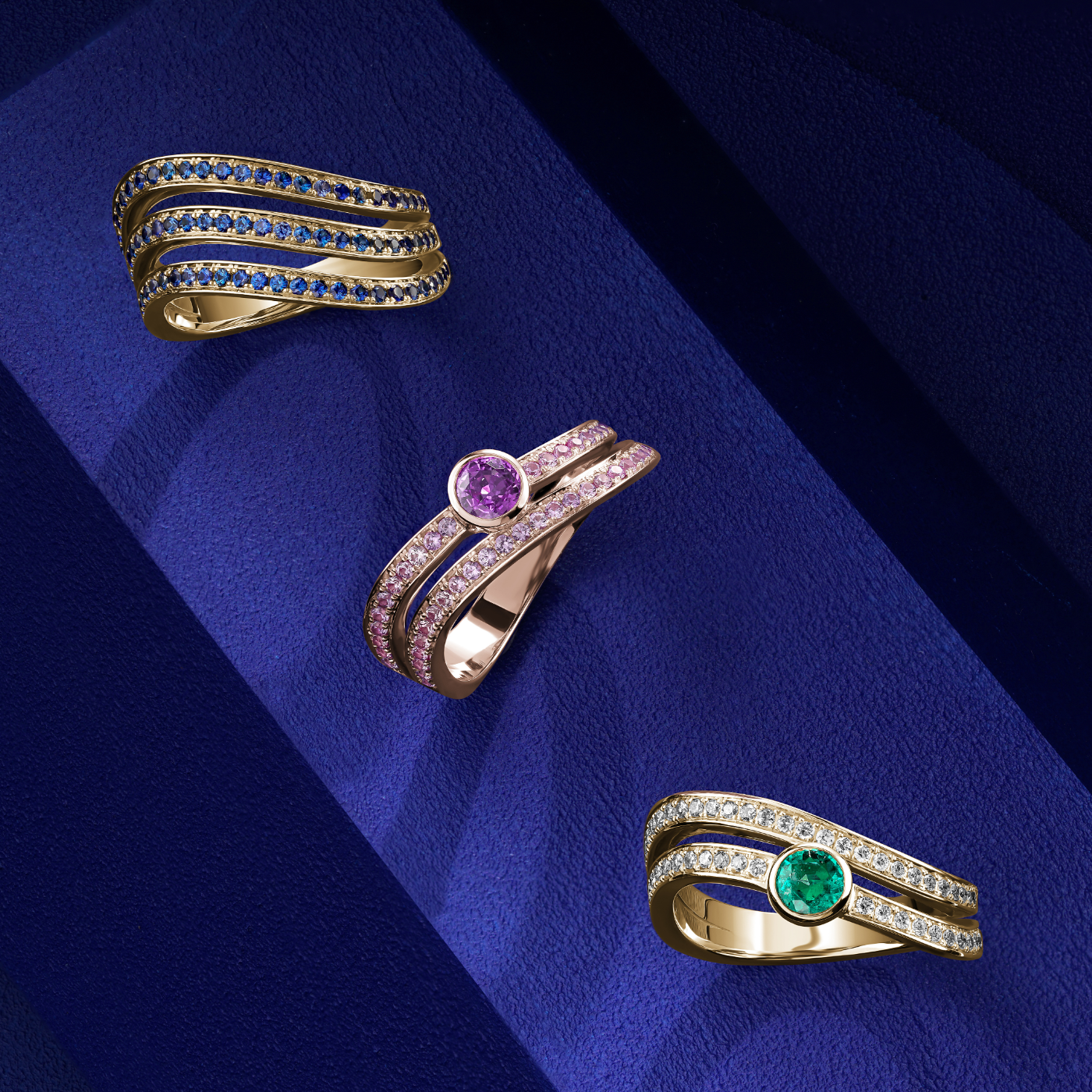 Triple Wavy Ring with a royal blue sapphires set in pave , iconic design by carati jewelry in montreal canada in 18k 14k in blue backround with other rings