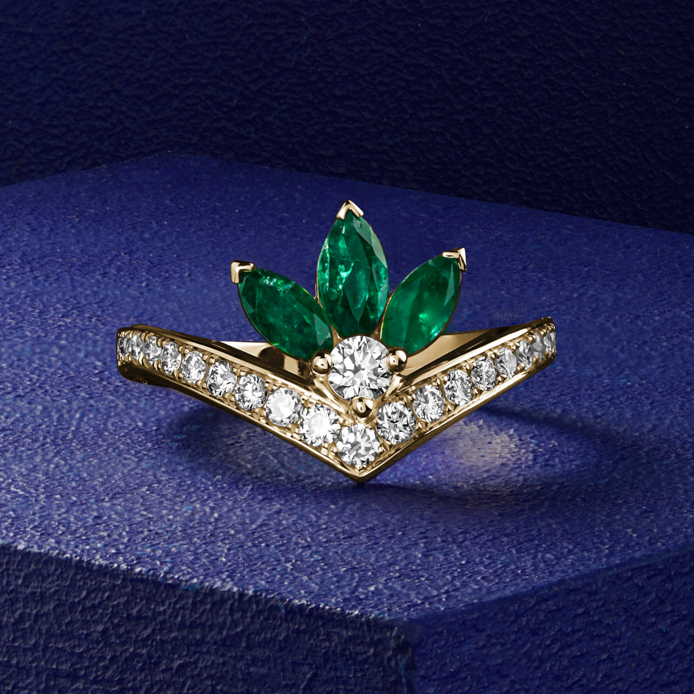 Majesty ring with marquise  Emeralds and pave set diamonds is designed by carati jewelry in Montreal Canada in 14k 18k in blue backround and zoomed