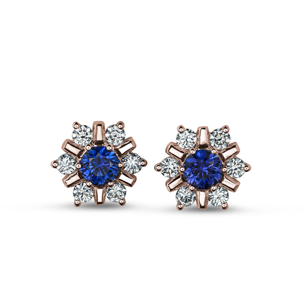 18 K rose GOLD snowflake design set center a blue sapphire and surrounded in diamonds carati jewelry montreal